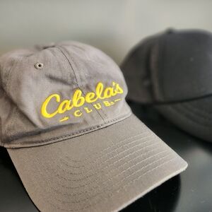 Cabela's Club Gray and Yellow Cap And Solid Black Port Authority Trucker Hat
